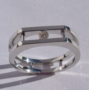 Mens / Ladies 14 Karat White Gold Ring with Round Channel Set Diamond.